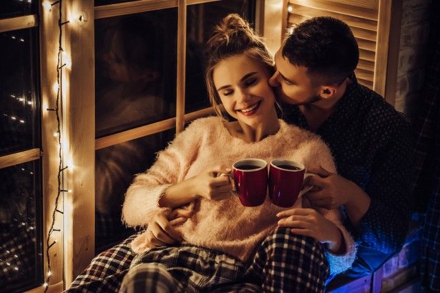 Young romantic couple is having fun outdoors in winter