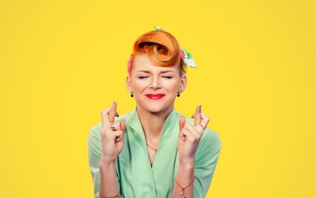 closeup-hopeful-beautiful-young-woman-pin-up-style-retro-crossing-her-picture-id667652750